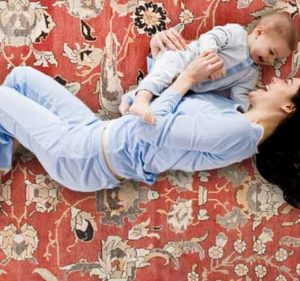 Woman on Rug with Baby
